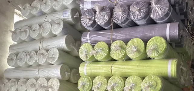Polybagged fabric rolls bundled and ready for export shipment